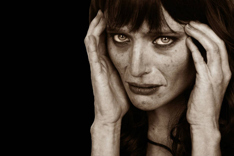 A woman looks gaunt and frightened at the effects of meth addiction, to show concept of recovery with Find Addiction Rehabs 