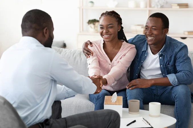 Happy couple overcome resentments in family therapy