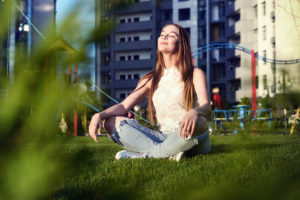 Life After Addiction | Find Addiction Rehabs | Woman sitting in yard enjoying sunrise