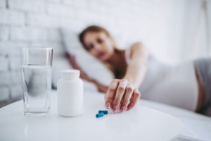 Drowsiness and Addiction | Signs of Addiction | Find Addiction Rehabs | Woman using sleeping pills as necessity for sleep