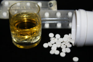Drug and Alcohol Abuse | Drug Overdose Deaths by State | Find Addiction Rehabs | Glass of whisky and prescription drugs