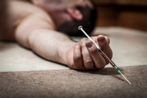 Rock Bottom Heroin Overdose | Find Addiction Rehabs | Man who suffered heroin overdose on tile floor
