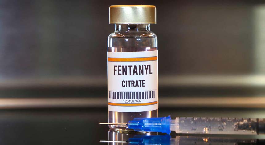 A bottle of prescription fentanyl citrate shows the concept of fentanyl overdose symptoms