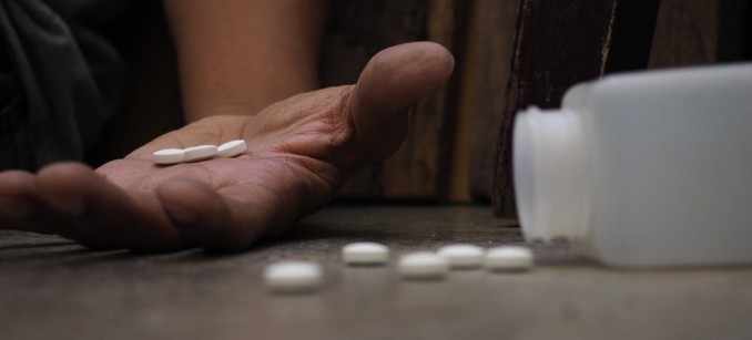 Outstretched hand with pills shows the dangers of Xanax withdrawal