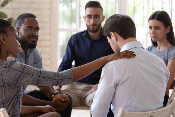 A man seeing help from an addiction support group near me, example of positive sober supports