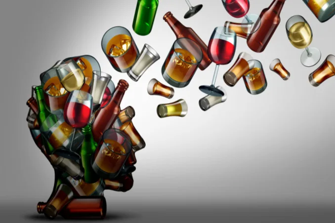 Bottles and alcohol leaving a silhouette head show the concept of quitting alcohol cold turkey