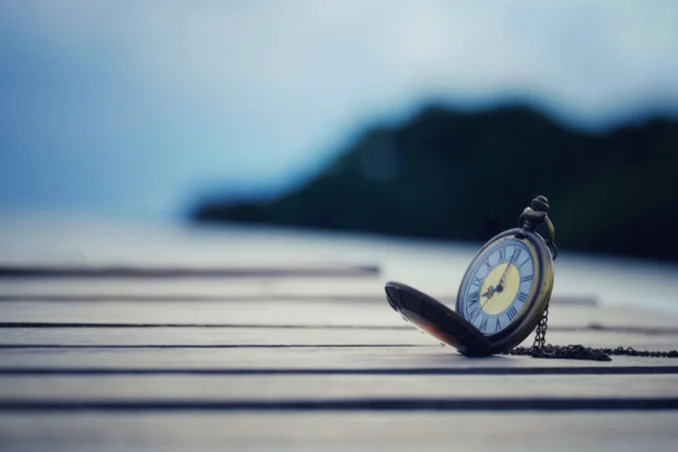 Pocket watch on dock shows the concept of timeline for alcohol withdrawal