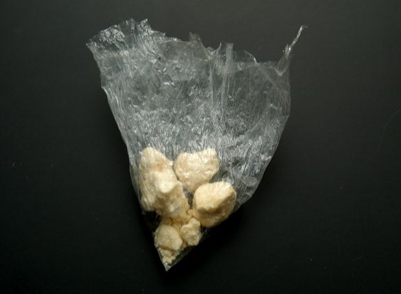 Corner of a bag of rock cocaine, to indicate crack addiction potential
