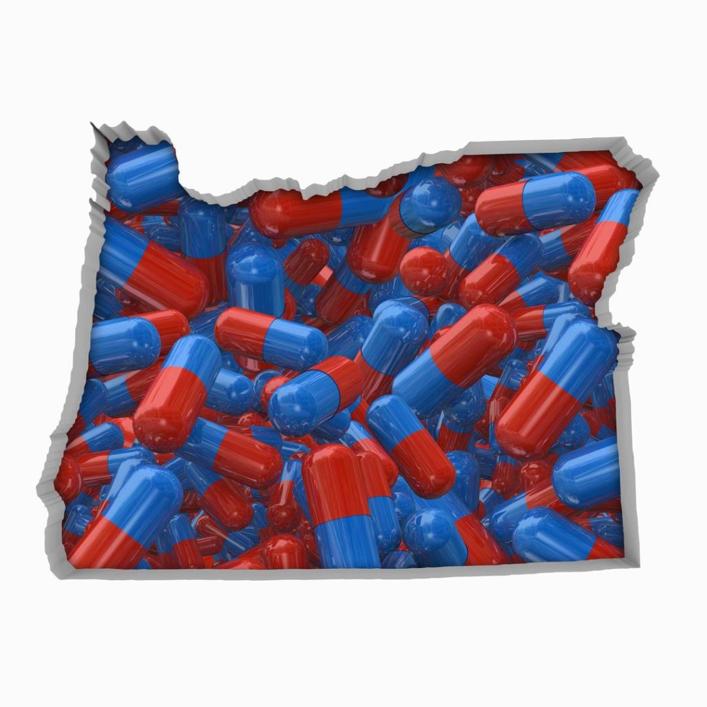 Outline of the state of Oregon filled with red and blue pills, to show the need and potential for drug rehab and alcohol rehab in Oregon