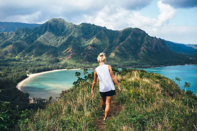 A woman on a mountaintop hike shows the joys of adventure therapy during addiction treatment in Hawaii