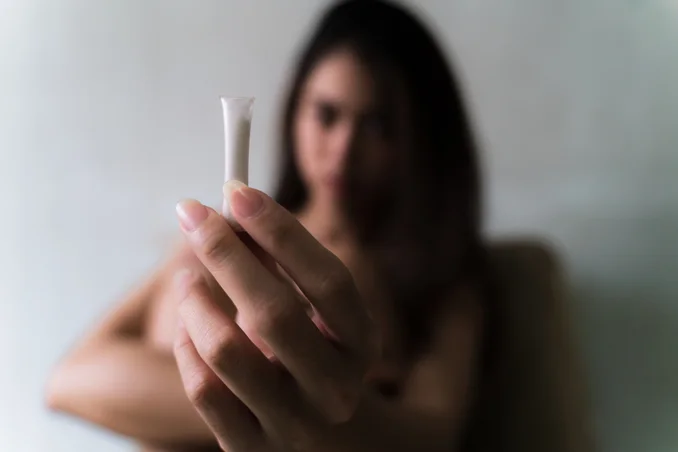 Woman holds cocaine