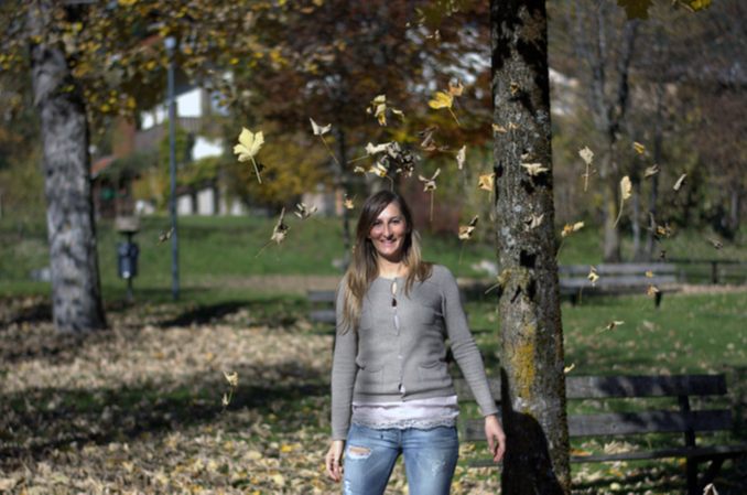 Michigan drug rehab success stories, as shown by a young woman with leaves falling down over her head