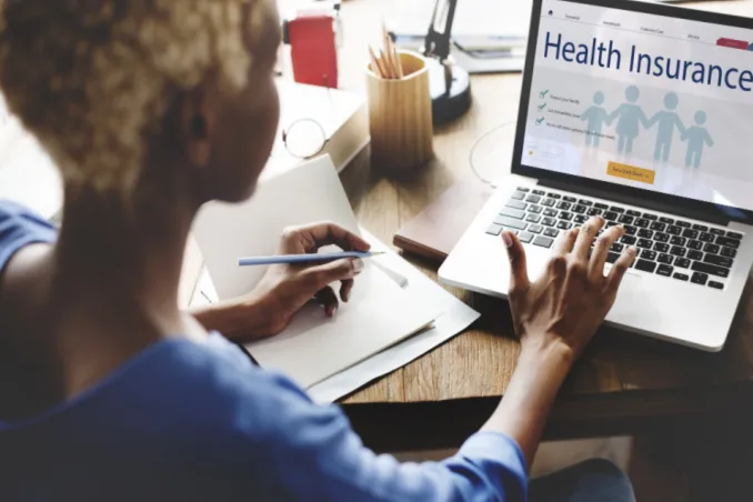 types of cigna policy for rehab coverage, as shown by woman searching on her laptop