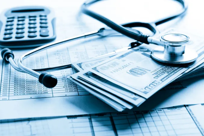 A stethoscope over money shows the benefits of Ambetter insurance for rehab