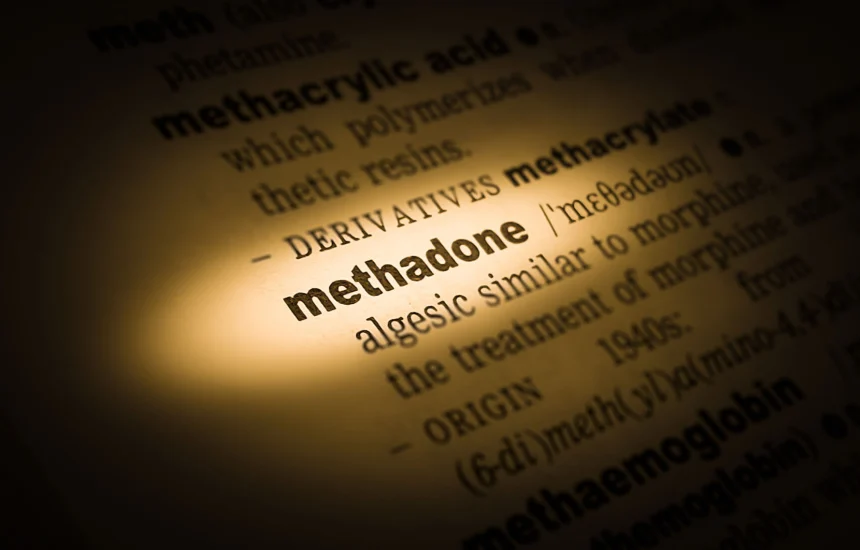 Dictionary open to the word methadone: definition shown