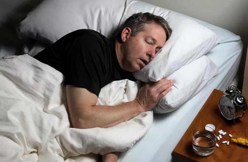 Man sleeping after taking sleeping pill